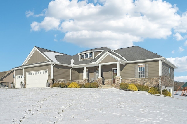 craftsman inspired home with a porch and a garage