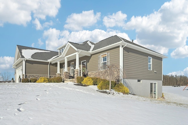 view of front facade featuring a garage and a porch