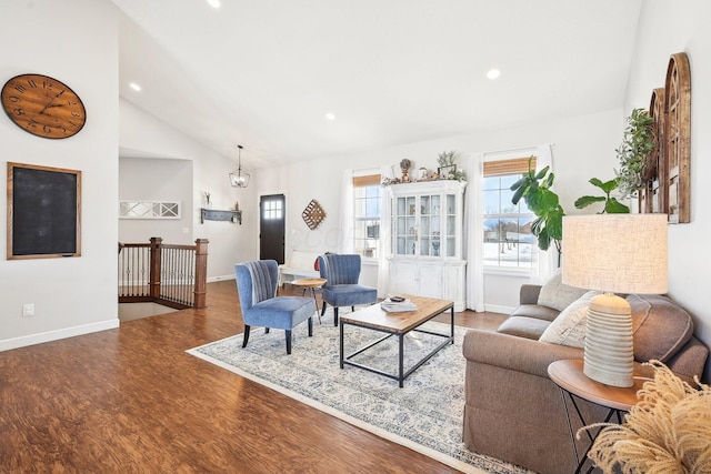 living room with hardwood / wood-style flooring and high vaulted ceiling