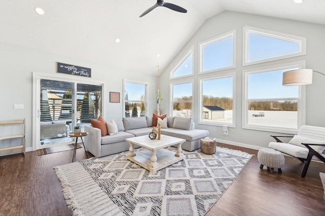 living room with plenty of natural light, dark hardwood / wood-style floors, and ceiling fan