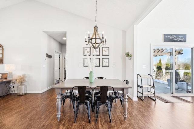 dining space featuring a notable chandelier, dark wood-type flooring, and vaulted ceiling