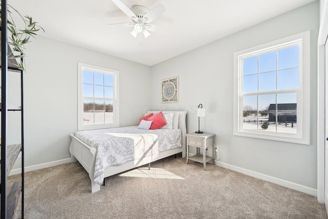 bedroom with ceiling fan and carpet