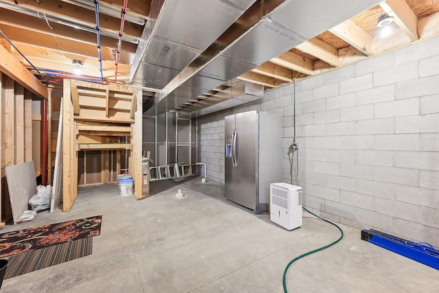 basement featuring stainless steel fridge