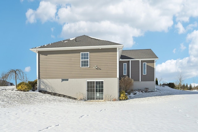 view of snow covered house