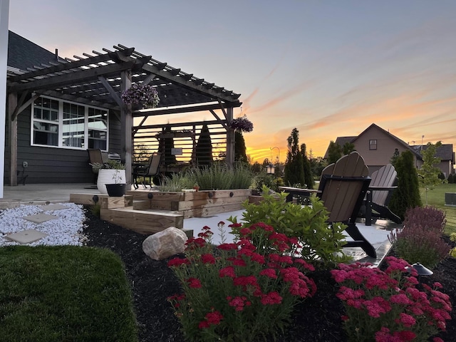 yard at dusk with a pergola and a patio