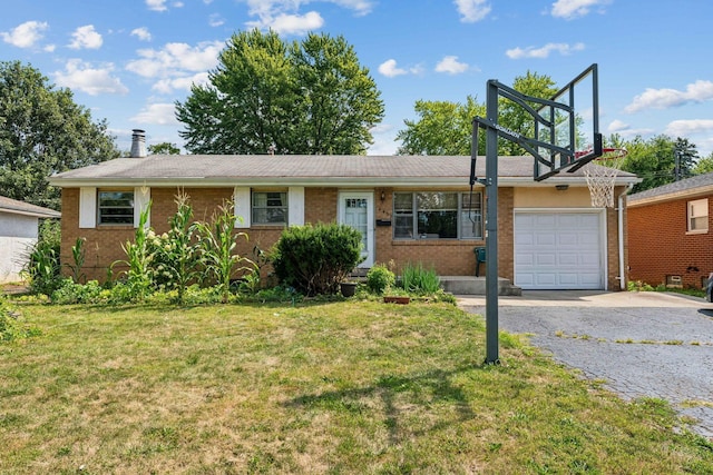 single story home featuring a garage and a front lawn