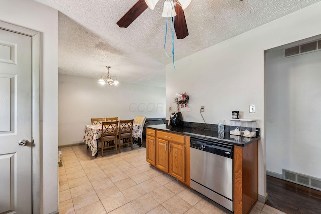 kitchen with decorative light fixtures, dishwasher, light tile patterned flooring, a textured ceiling, and ceiling fan with notable chandelier