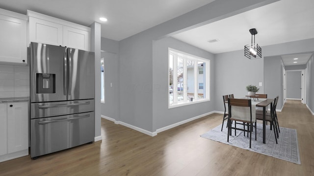 dining area with hardwood / wood-style flooring