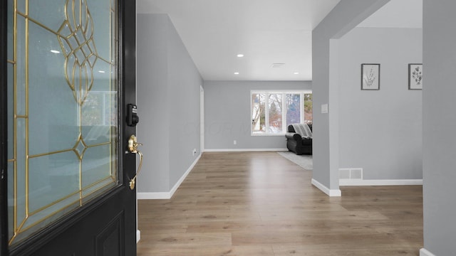 foyer with light wood-type flooring