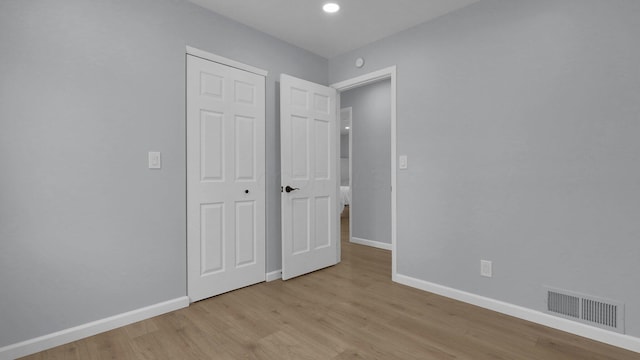 unfurnished bedroom featuring light wood-type flooring