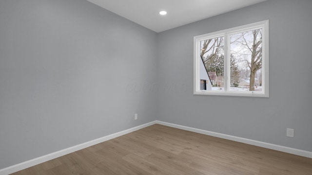 spare room with light wood-type flooring