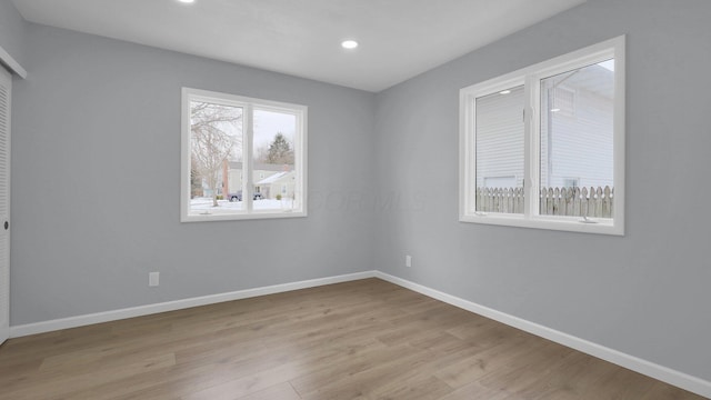 spare room featuring light hardwood / wood-style floors