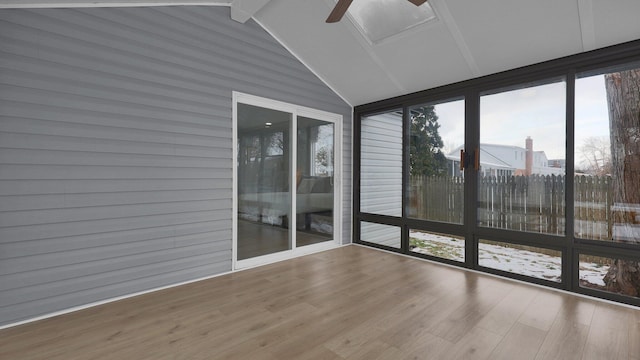 unfurnished sunroom featuring ceiling fan and lofted ceiling