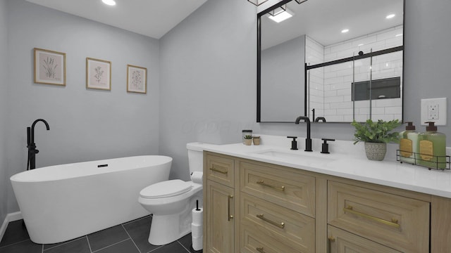 full bathroom featuring toilet, vanity, tile patterned flooring, and separate shower and tub