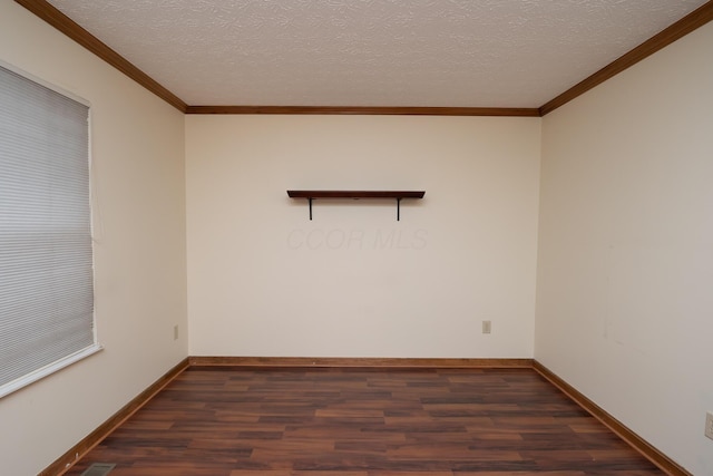 spare room with dark wood-style floors, crown molding, and a textured ceiling