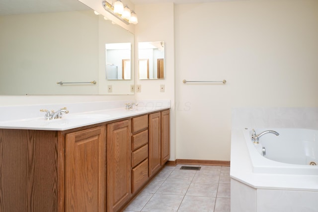 bathroom with a garden tub, double vanity, visible vents, a sink, and tile patterned floors