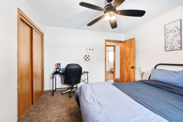 carpeted bedroom with a textured ceiling, ceiling fan, and a closet