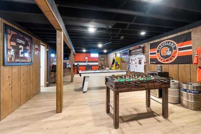 recreation room with pool table, wooden walls, and light hardwood / wood-style floors