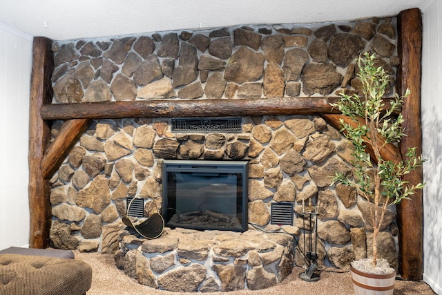 interior details with carpet flooring, a textured ceiling, and a fireplace