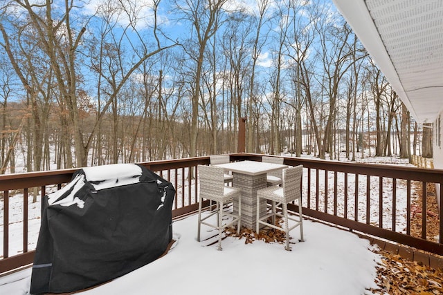 snow covered deck with area for grilling