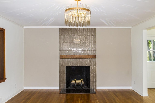 unfurnished living room with ornamental molding, a fireplace, and hardwood / wood-style flooring