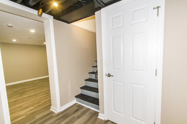 staircase featuring hardwood / wood-style flooring