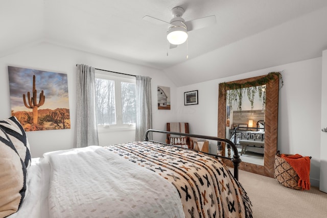 carpeted bedroom with lofted ceiling and ceiling fan