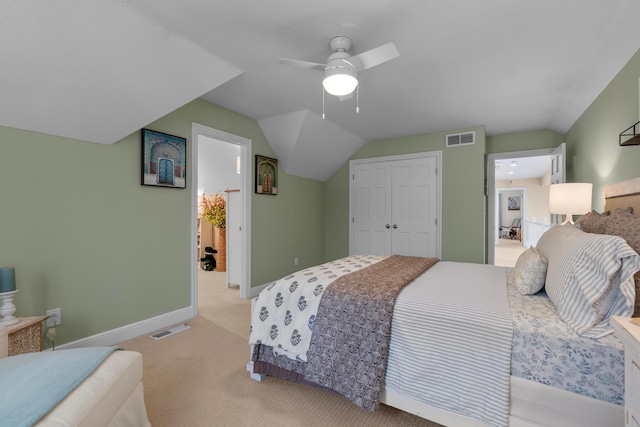 carpeted bedroom featuring lofted ceiling, a closet, and ceiling fan