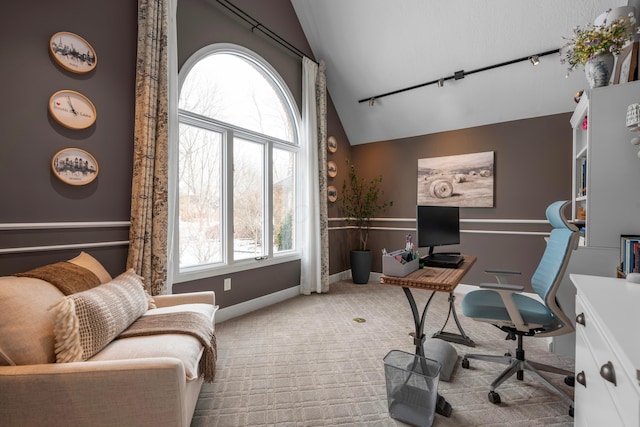 office area featuring lofted ceiling and carpet