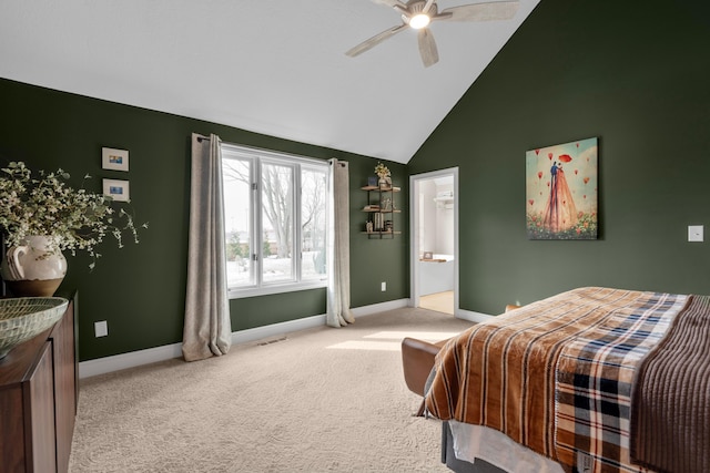 carpeted bedroom with ensuite bath, high vaulted ceiling, and ceiling fan