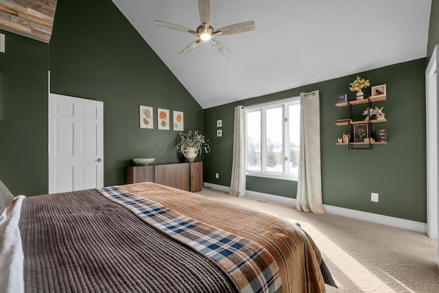 carpeted bedroom featuring ceiling fan and high vaulted ceiling