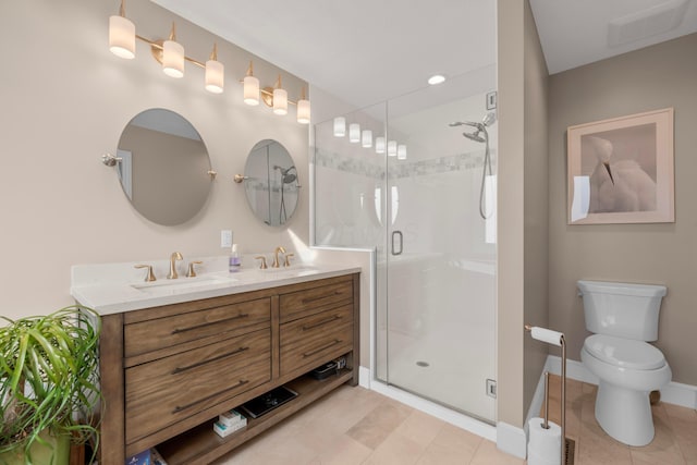 bathroom featuring vanity, toilet, and walk in shower