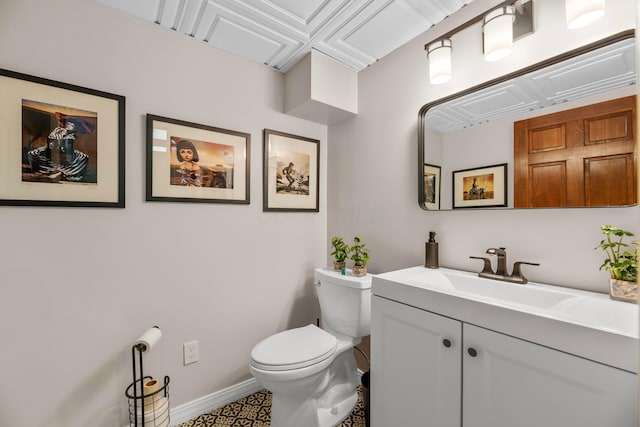 bathroom featuring vanity and toilet