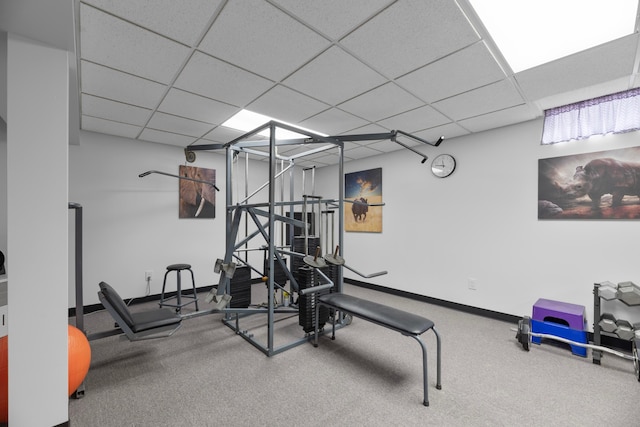 exercise room featuring a drop ceiling