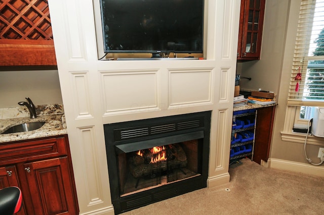 interior details featuring carpet floors and indoor wet bar