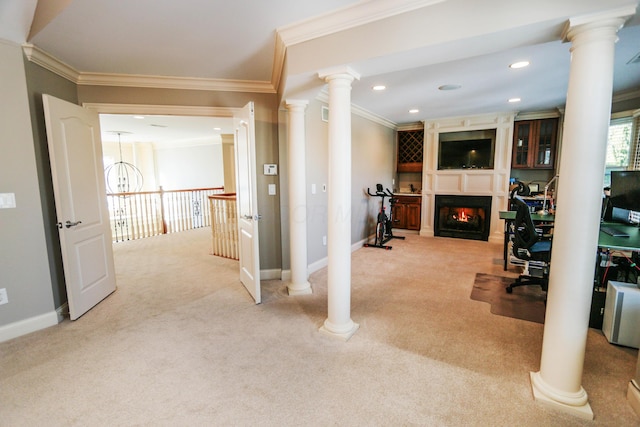 hallway with decorative columns, ornamental molding, and light carpet