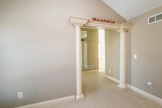 hallway with light carpet and ornate columns