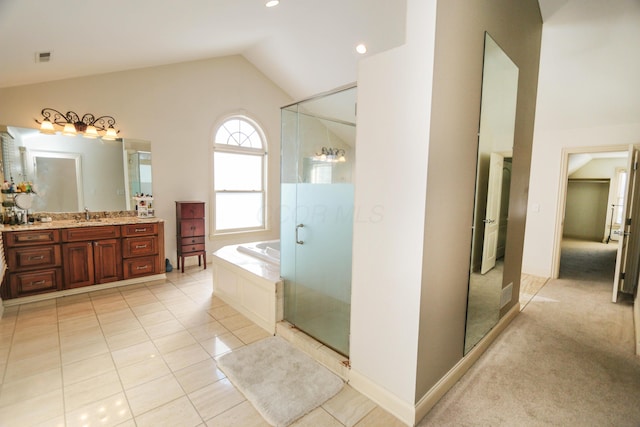 bathroom featuring vanity, shower with separate bathtub, lofted ceiling, and tile patterned flooring