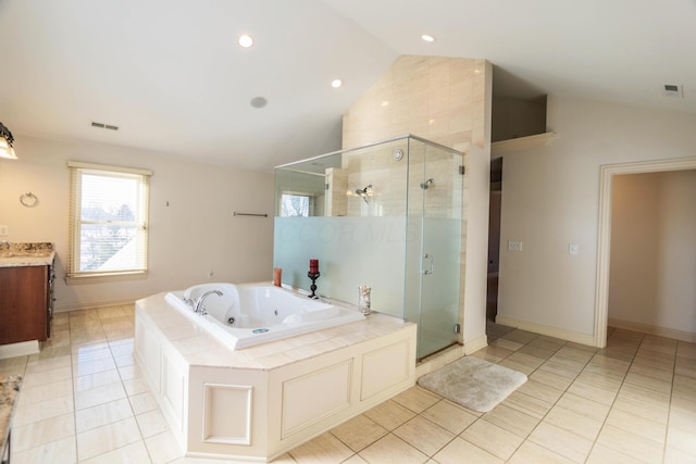 bathroom with separate shower and tub, vanity, vaulted ceiling, and tile patterned flooring