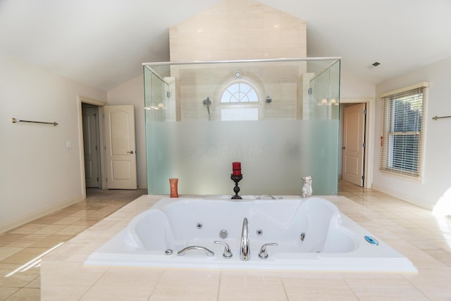 bathroom featuring vaulted ceiling, tile patterned floors, and plus walk in shower