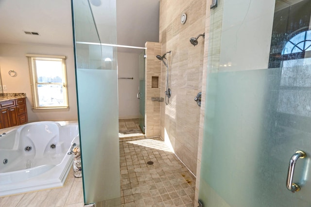 bathroom with separate shower and tub and vanity