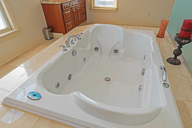 bathroom featuring tile patterned floors and a relaxing tiled tub