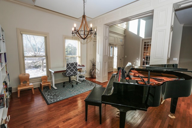 misc room featuring an inviting chandelier, ornamental molding, and hardwood / wood-style flooring