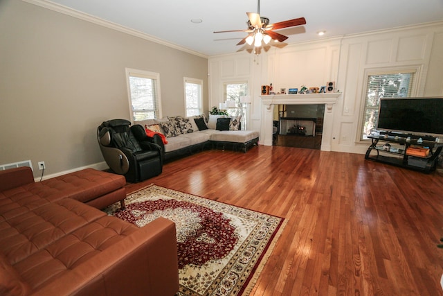 living room featuring ceiling fan, crown molding, and hardwood / wood-style floors