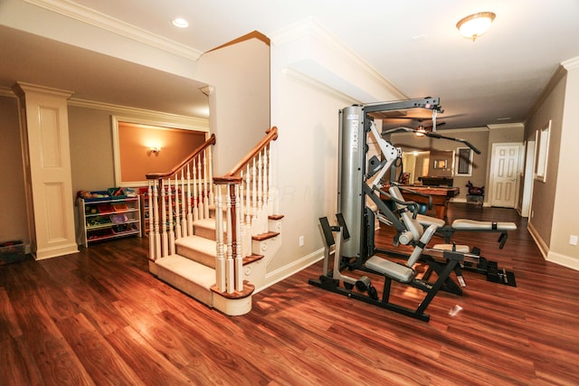 workout area with crown molding and wood-type flooring