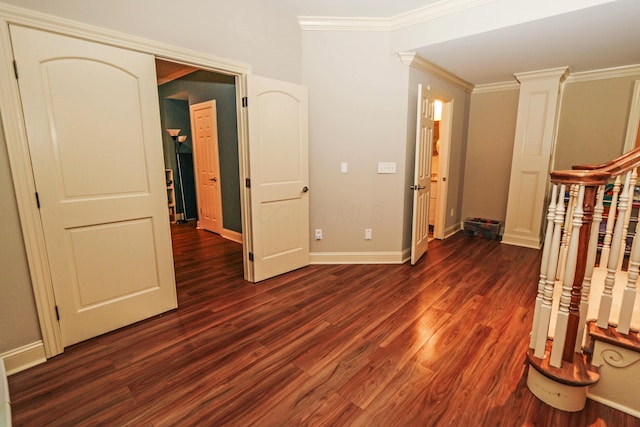 interior space with ornamental molding and dark hardwood / wood-style floors