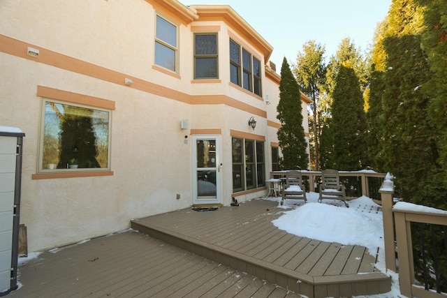 view of snow covered deck