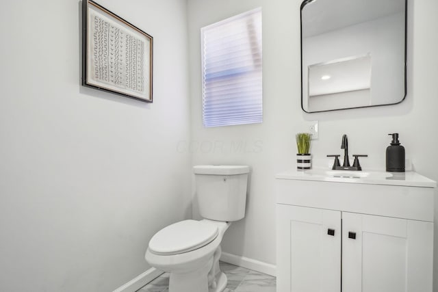 bathroom with toilet and vanity