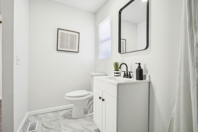 bathroom with toilet and vanity