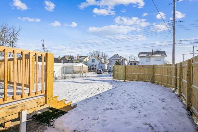 view of yard covered in snow